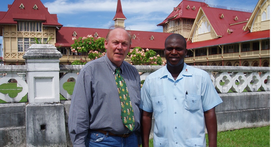 Jonathan with his driver outside the Supreme Court of Judicature and the High Court of Guyana